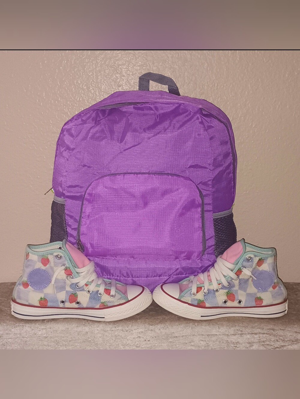 Converse All Star Pink/Strawberry sneakers with purple nylon 17-inch backpack.